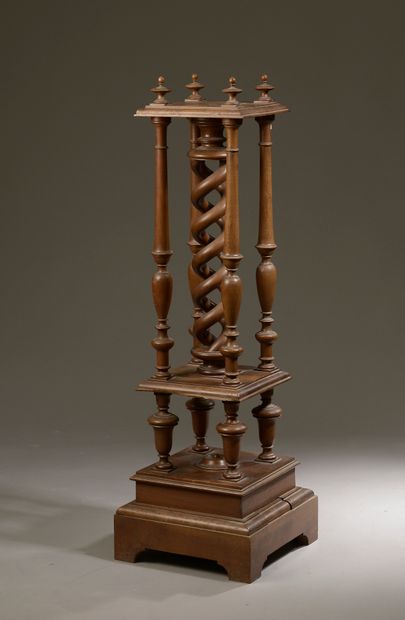 null Square walnut pedestal, the high shelf supported by four turned columns and...