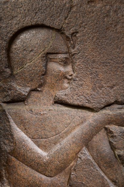 null 
Granite bas-relief representing a king in profile on the right, dressed in...