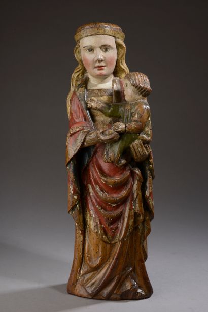 Vierge à l'Enfant en noyer sculpté et polychromé....