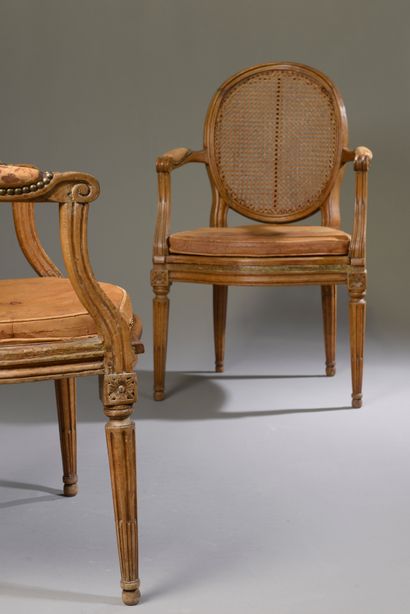 null Pair of caned armchairs in molded and carved beech, the medallion backs in cabriolet...
