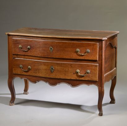Molded walnut chest of drawers opening to...