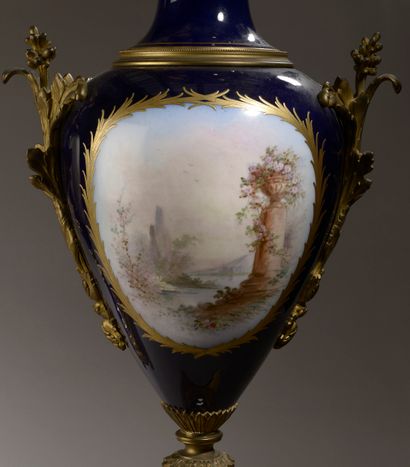 null Important pair of flared neck vases on pedestal in porcelain with a blue-night...