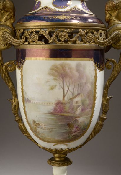 null Porcelain potpourri vase with pedestal and swollen lid richly painted with a...
