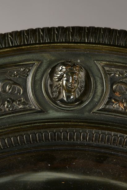 null 
Pedestal table in chased and gilded bronze, the top decorated with scrolls...