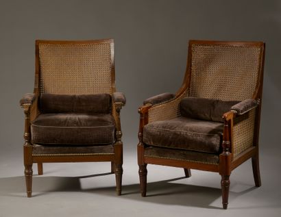 Pair of mahogany caned bergères, the back...