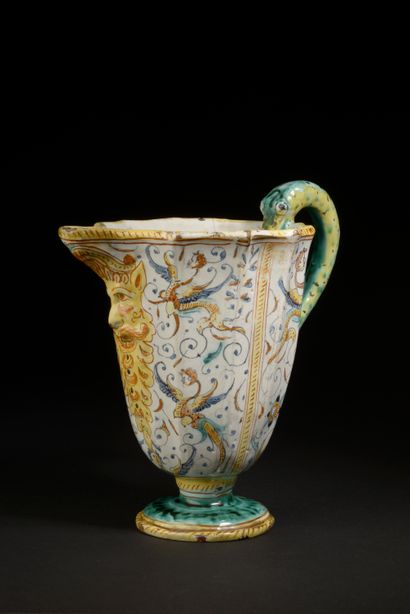 Ewer with cut sides in majolica, the handle...