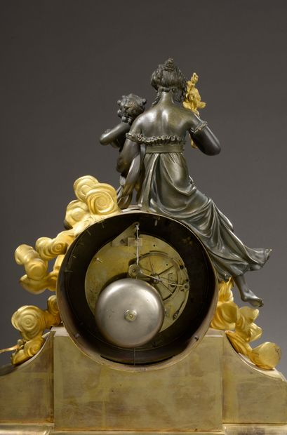 null Clock in chased and gilded bronze. The white enamelled dial with Roman numerals...