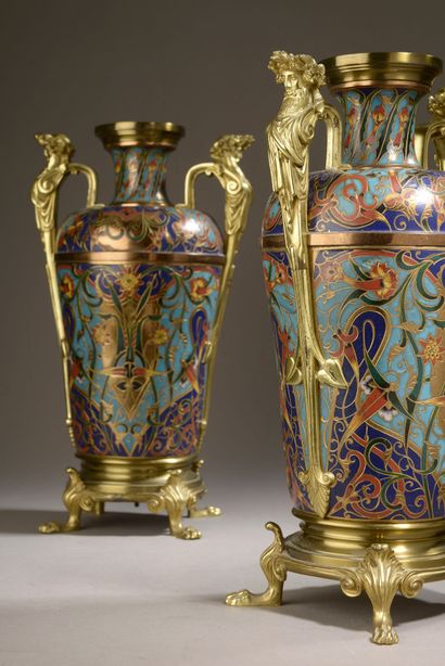 null 
Pair of bronze ornamental vases with champlevé enamel decoration of leafy and...