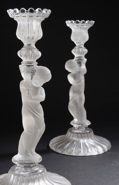 null Pair of girandoles or torches in clear molded crystal and satin, the shaft representing...