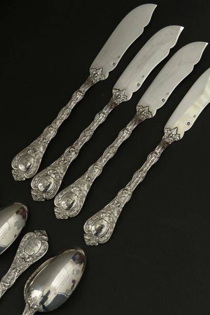 null Twelve large spoons and twelve knives with fish out of silver 950 thousandths,...