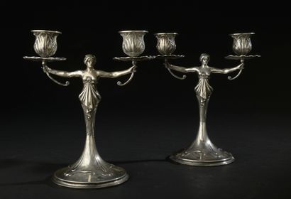 null Pair of candlesticks in silver 800 thousandths, formed by two women in sheath,...