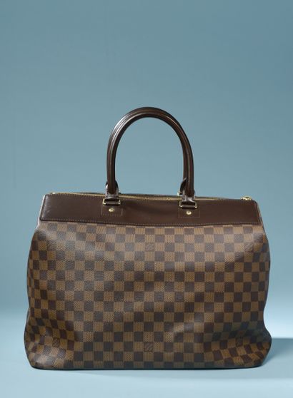null LOUIS VUITTON "Greenwich".

Travel bag in ebony coated canvas and smooth chocolate...