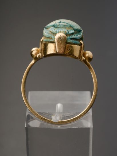 null Egyptomania ring in 18k pink gold presenting a turquoise blue ceramic scarab,...