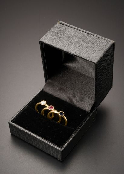 Three rings in 18k yellow gold, set with...