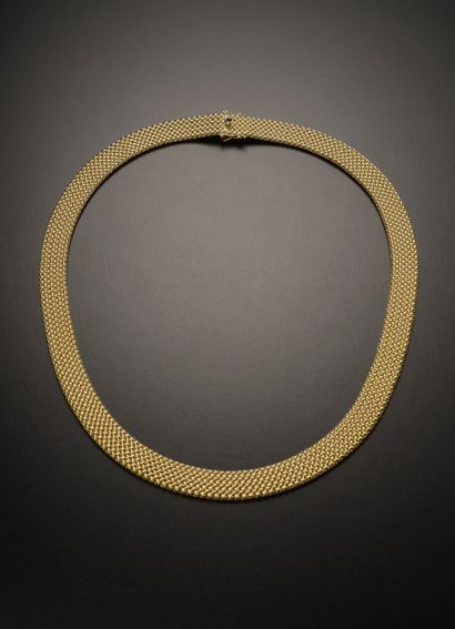 null CAPELIN.

Collier ruban en or jaune 18k à maille polonaise, le fermoir à cliquet...