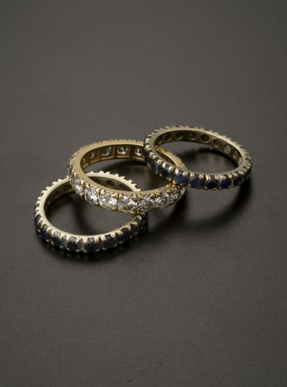 null Set of three American wedding rings in 18k gold, two in white gold set with...