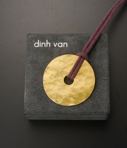 null DINH VAN "Chinese Pi".

Pendant disc in hammered 24k yellow gold.

Accompanied...