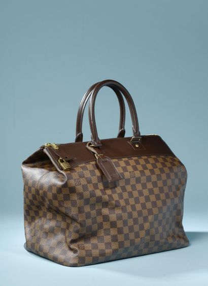 null LOUIS VUITTON "Greenwich".

Travel bag in ebony coated canvas and smooth chocolate...