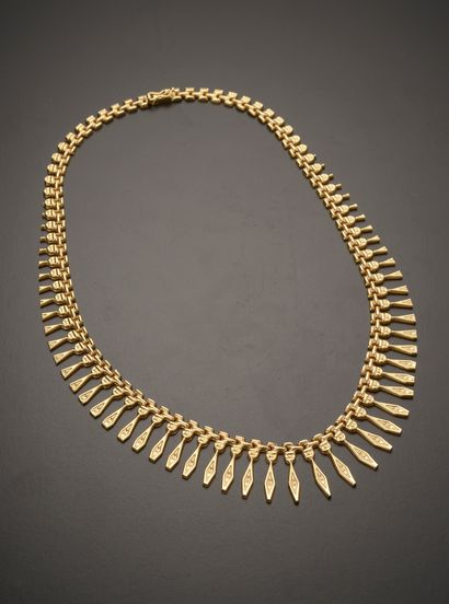 null 18k yellow gold drapery necklace with geometrical links, the clasp with secured...