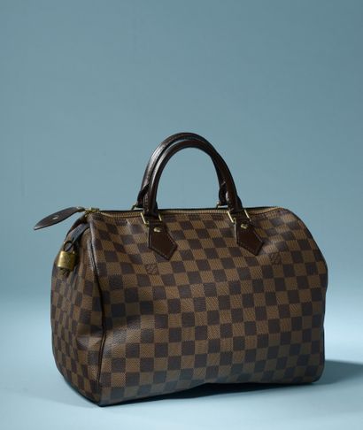null LOUIS VUITTON "Speedy".

Handbag in ebony coated canvas, the two handles in...
