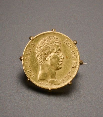 null Brooch in 14k yellow gold presenting a gold coin of 40 Francs with the profile...