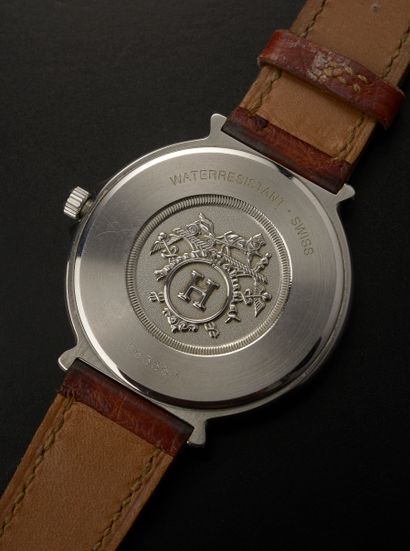 null HERMÈS.

Wristwatch, round stainless steel case, white dial with Arabic and...