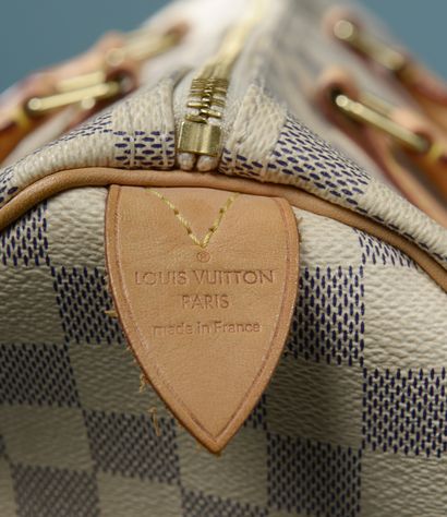 null LOUIS VUITTON "Speedy".

Handbag in azure checkerboard canvas and natural leather,...