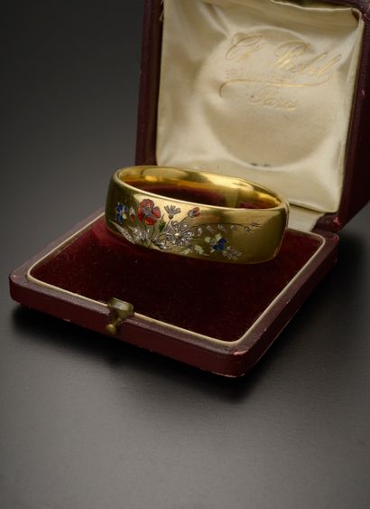 null Bracelet jonc en or jaune 18k présentant un motif de fleurs sauvages en émail...