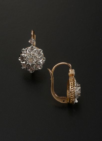 null Pair of 18k rose and white gold sleepers, with rose-cut diamonds.

French work.

Height...