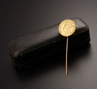 Tie pin in 18k yellow gold presenting a gold...