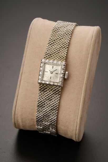 null OCEDOS.

18k white gold wristwatch, the square case set with modern brilliant-cut...