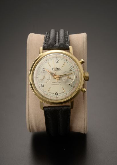 null EVIANA.

Chronograph wristwatch, round case in 18k yellow gold, silvered dial...