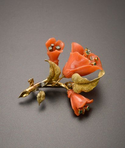 null 18k yellow gold brooch featuring a flowering branch, the flowers composed of...