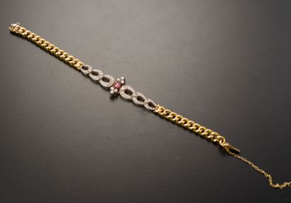 Bracelet en or jaune et gris 18k, le motif...
