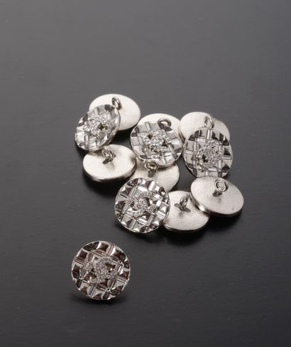 CHANEL. 

Set of twelve silver metal buttons,...
