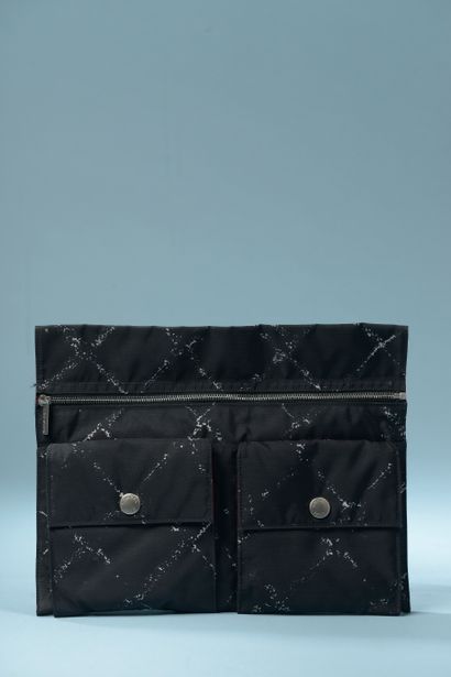 CHANEL.

Black and white printed canvas clutch...