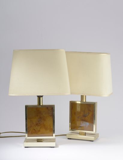 null Pair of lamps in folded metal and gilded, the body set with a stratified golden...