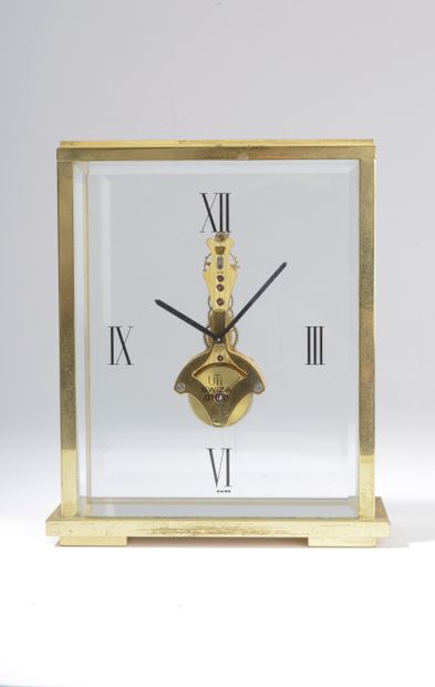 null UTI SWIZA.

Rectangular cage clock model "Athena" in gilded brass and beveled...