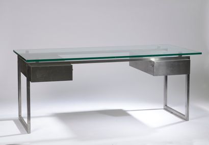 null Modernist desk with a rectangular tubular structure in stainless steel, holding...