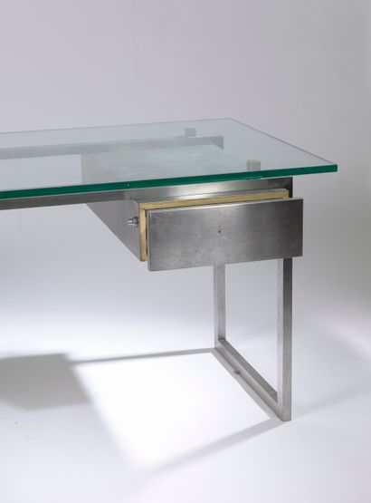 null Modernist desk with a rectangular tubular structure in stainless steel, holding...