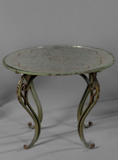 null 
Coffee table with circular top and structure in wrought iron painted in green...