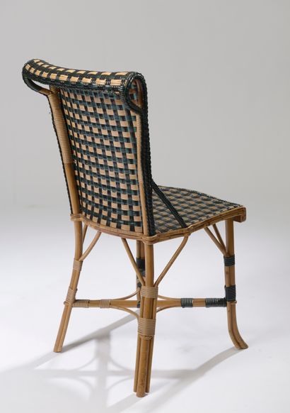 null Eight beige tinted woven rattan chairs, upholstered with green and black fibers...