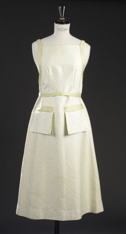 null COURRÈGES.

White and apple green cotton long dress, with straps, cinched at...