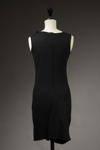 null AZZARO.

Sleeveless dress in black synthetic knit, embellished with a ruffle...