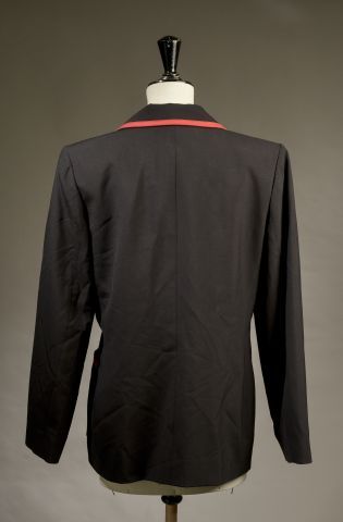 null YVES SAINT LAURENT Variation.

Black wool jacket with red braid, notched collar,...