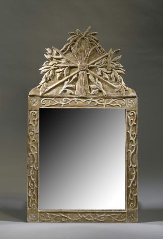 Wooden mirror with a pediment decorated with...