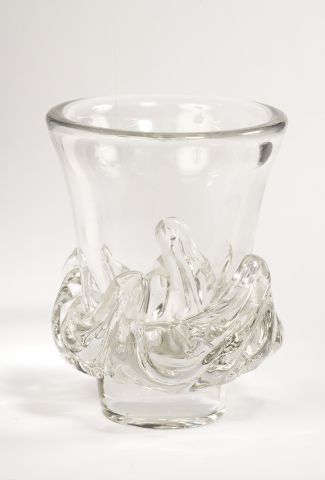A large flared crystal vase with a wave design...