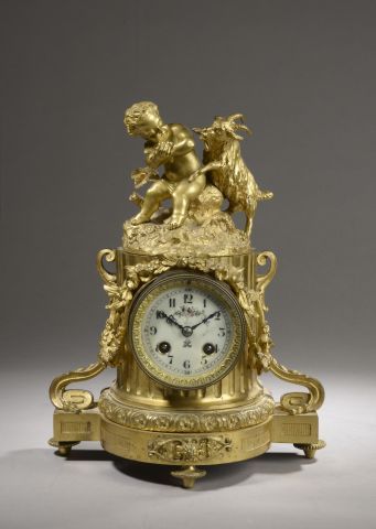 Gilt bronze clock, the dial carried by a...