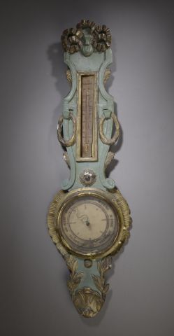 null Barometer-thermometer in carved basswood, stuccoed, green relacquered and redecorated....