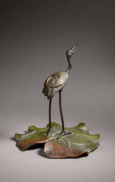 null CHINA - 20th century. 

Polychrome bronze subject representing a crane on a...